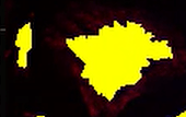 A yellow object with black background Description automatically generated