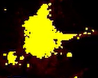 A yellow spot on a black background Description automatically generated
